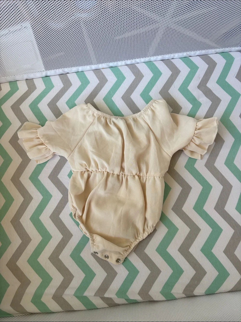 Cream Bow-Front Baby One-Piece Bodysuit
